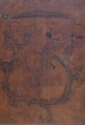 Figur, die einen Drachen reitet